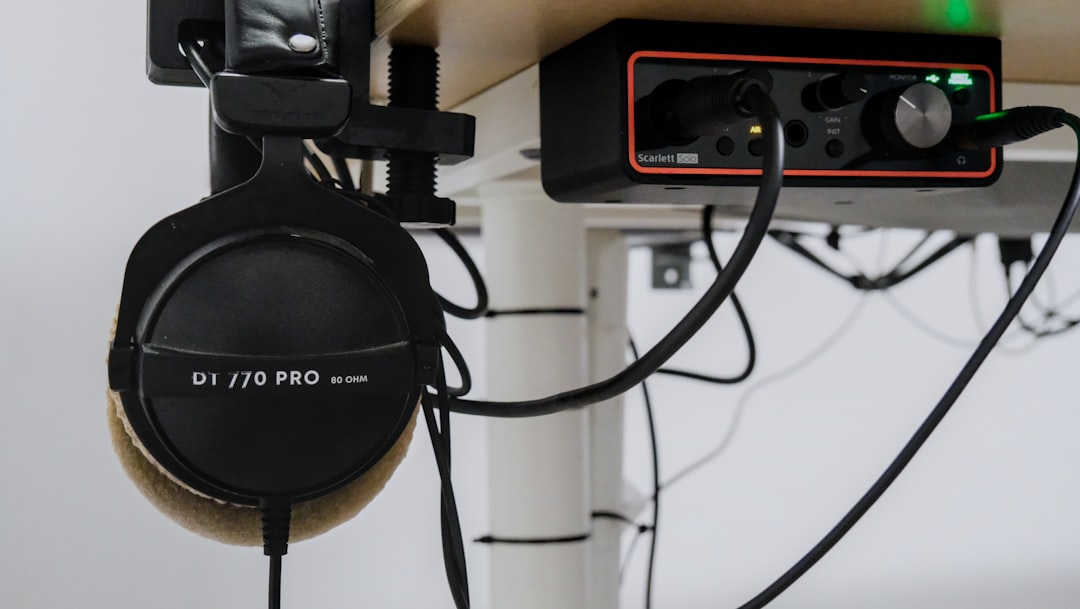 Music notebook and audio interface on a studio desk